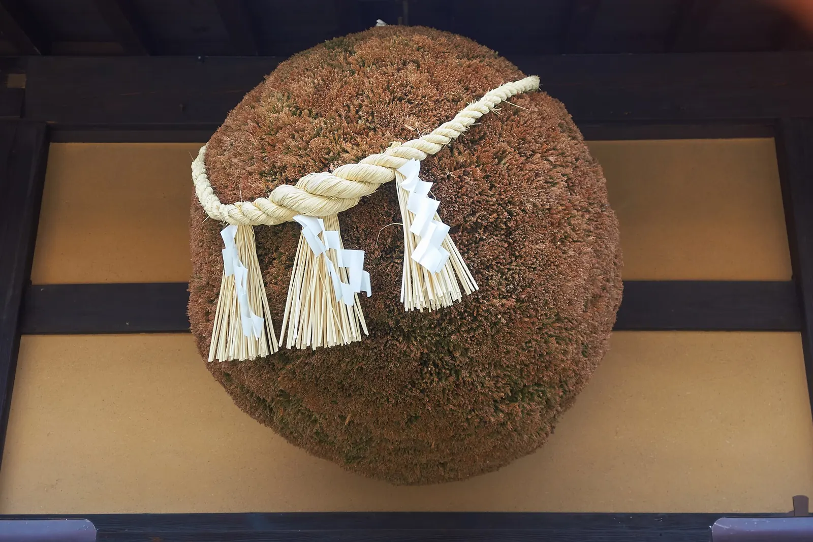 A sugidama cedar ball outside a sake brewery in Takayama